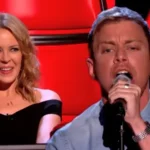 Lee Glasson’s Haunting Take on Kylie Minogue’s Hit Stuns The Voice UK – EN Fjalaefundit Lee Glasson’s Haunting Take on Kylie Minogue’s Hit Stuns The Voice UK - EN Fjalaefundit