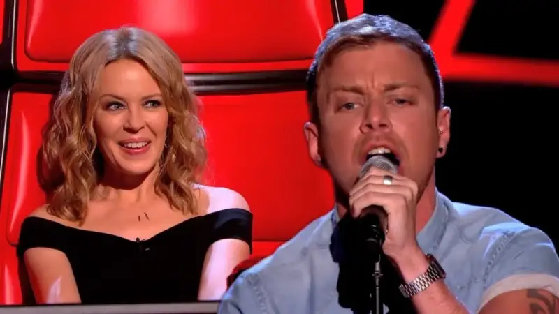 Lee Glasson’s Haunting Take on Kylie Minogue’s Hit Stuns The Voice UK - EN Fjalaefundit